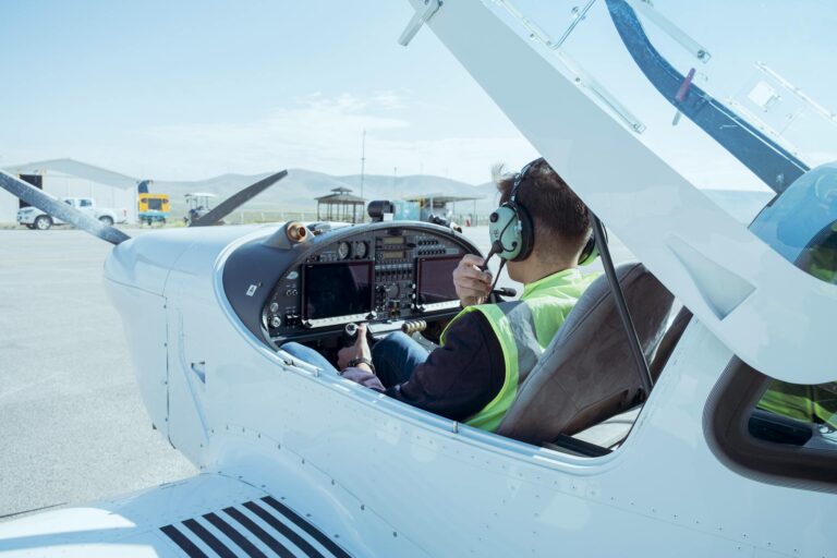 A pilot in the cockpit of a small aircraft readying for flight at Konya Airport, T&uuml;rkiye.